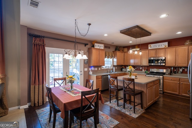 dining space with sink and dark hardwood / wood-style floors