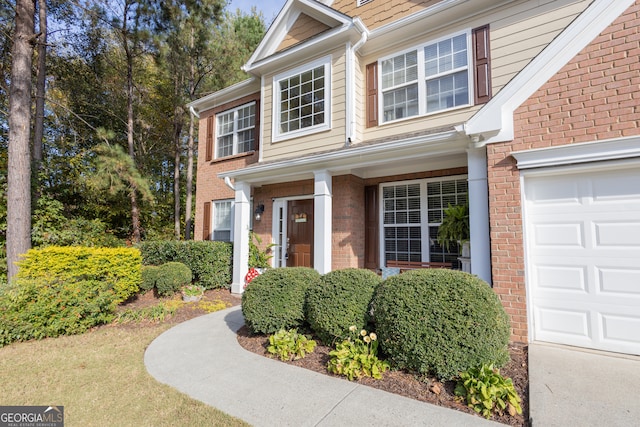 doorway to property featuring a garage