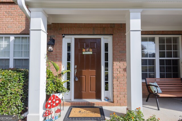 doorway to property with a porch