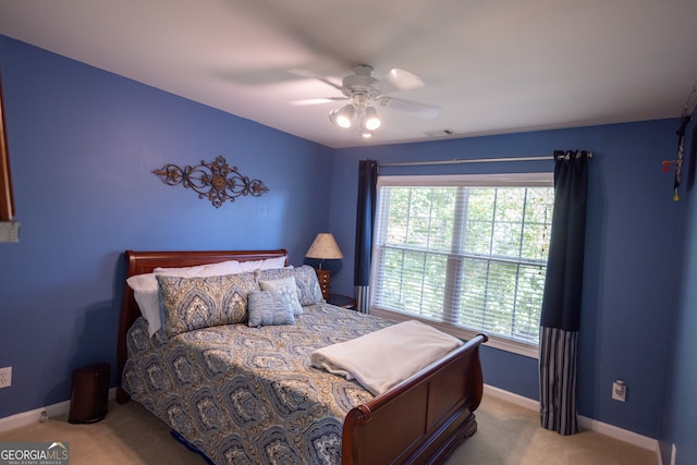 carpeted bedroom with ceiling fan