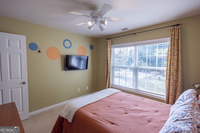 carpeted bedroom featuring ceiling fan