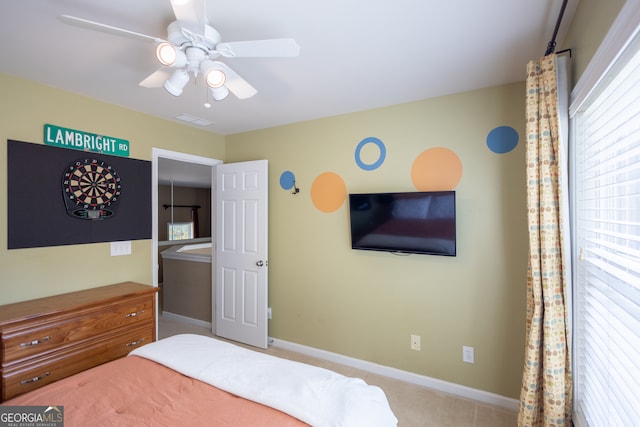 carpeted bedroom with ceiling fan