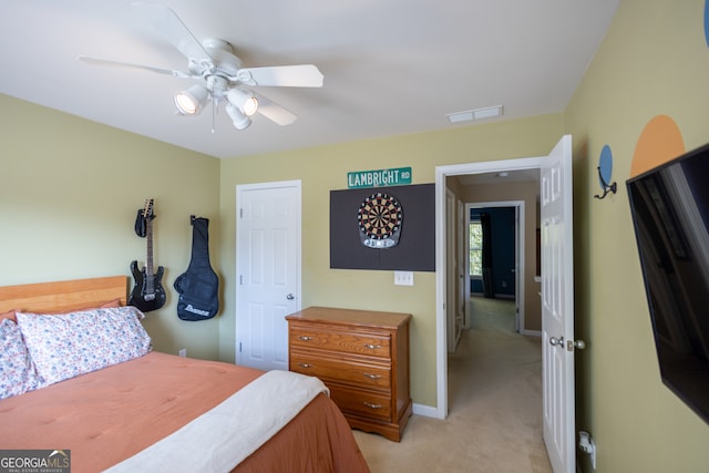 bedroom featuring light carpet and ceiling fan