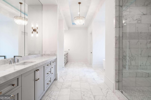 bathroom featuring vanity, a raised ceiling, and independent shower and bath