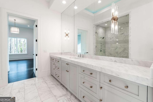 bathroom with vanity, hardwood / wood-style floors, and walk in shower