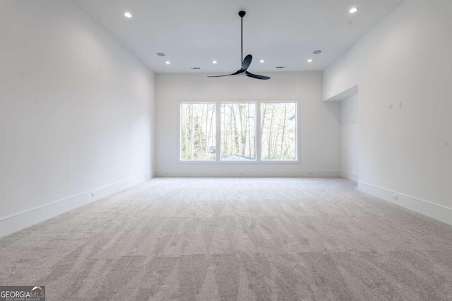 carpeted empty room with ceiling fan