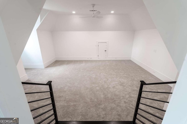 additional living space featuring ceiling fan, carpet, and lofted ceiling