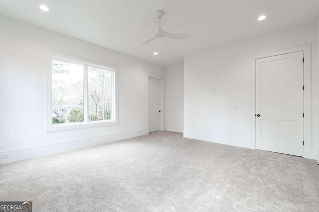 carpeted empty room with ceiling fan