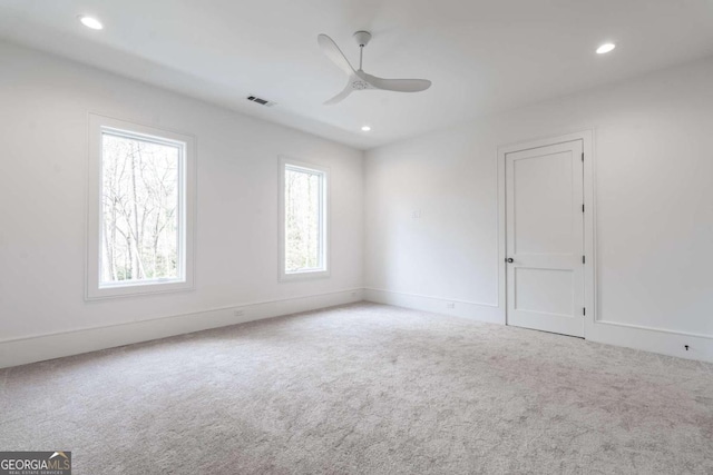 carpeted empty room with ceiling fan