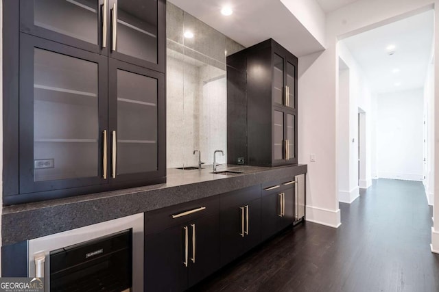 bar with wine cooler, sink, and dark hardwood / wood-style floors