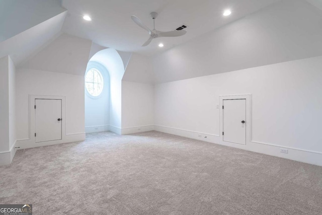 bonus room featuring ceiling fan, lofted ceiling, and light colored carpet