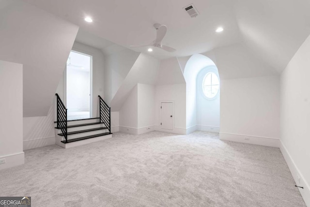 bonus room featuring lofted ceiling, light colored carpet, and ceiling fan