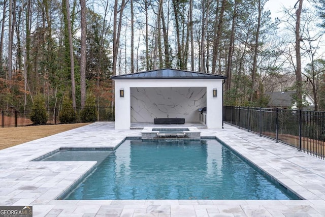 view of swimming pool with an in ground hot tub and a patio area