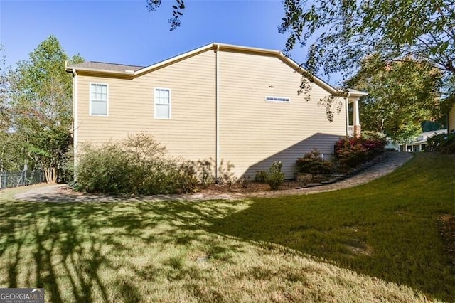 view of property exterior featuring a yard