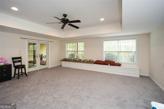 unfurnished room featuring french doors, carpet floors, and plenty of natural light