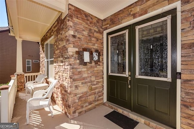 entrance to property featuring a porch