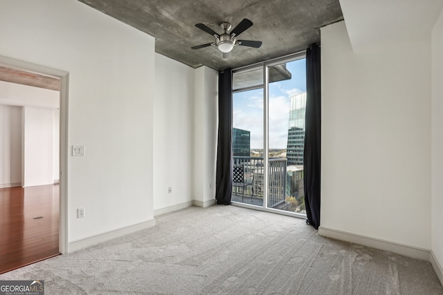 unfurnished bedroom with ensuite bathroom, ceiling fan, and light carpet