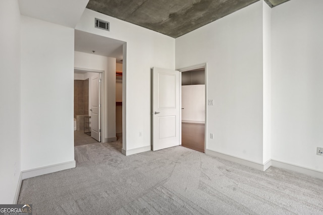 spacious closet with light tile patterned floors