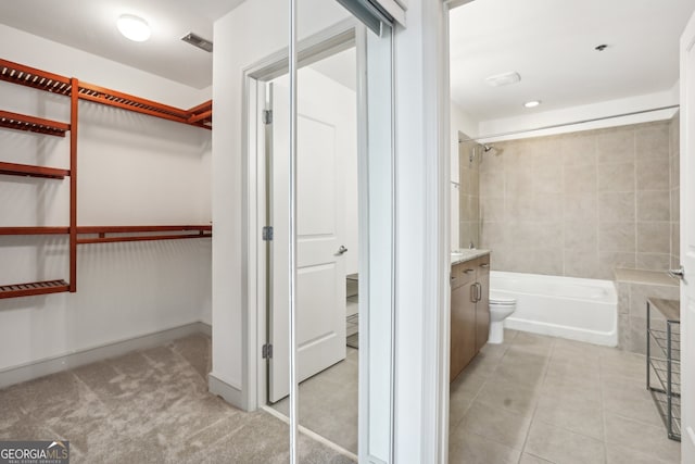 bathroom with tile patterned flooring and vanity