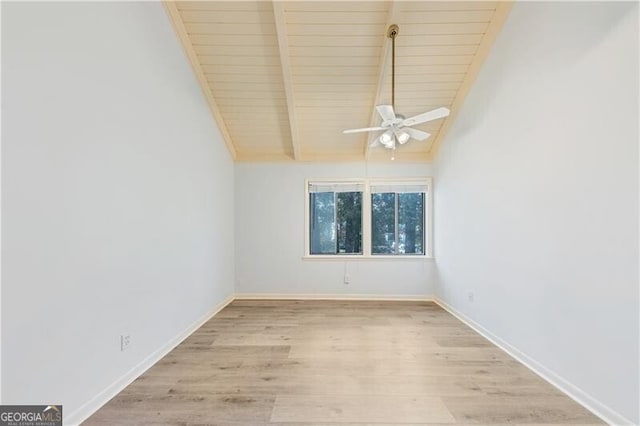 unfurnished room with vaulted ceiling with beams, light wood-type flooring, ceiling fan, and wooden ceiling