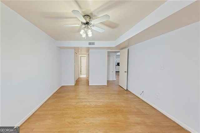 spare room featuring ceiling fan and light wood-type flooring