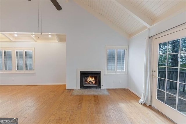 unfurnished living room with wood ceiling, ceiling fan, beam ceiling, high vaulted ceiling, and light hardwood / wood-style floors