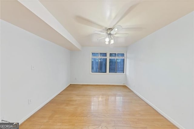 spare room featuring ceiling fan and light hardwood / wood-style flooring