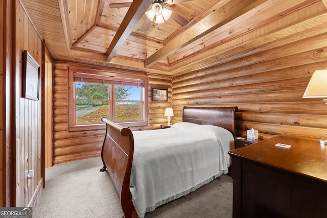 carpeted bedroom with rustic walls, wooden ceiling, ceiling fan, and beam ceiling