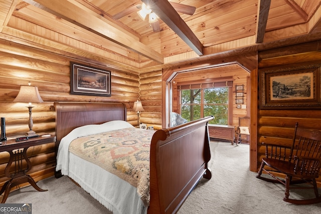 carpeted bedroom featuring beamed ceiling, wooden ceiling, ceiling fan, and log walls