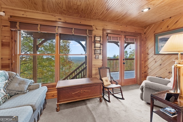 sunroom featuring wooden ceiling and french doors