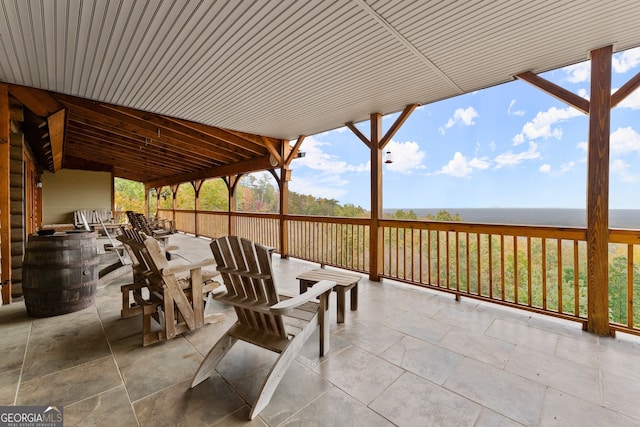 view of patio / terrace featuring a deck with water view