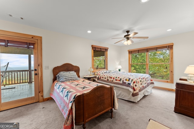 bedroom with access to exterior, carpet flooring, and ceiling fan