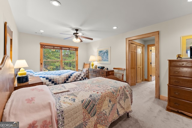 carpeted bedroom with ceiling fan