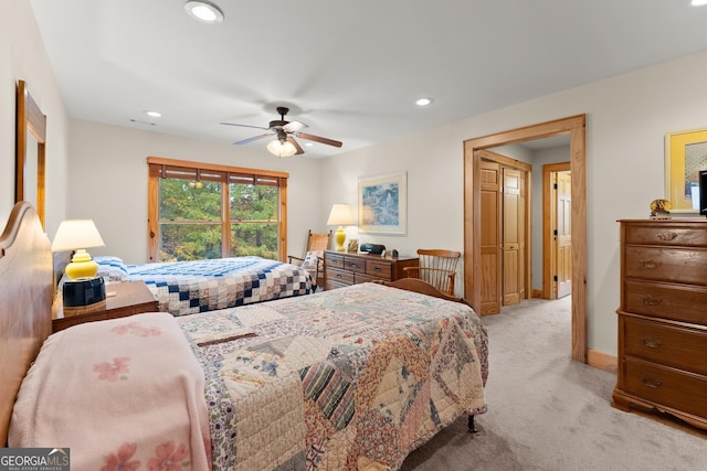 bedroom with light colored carpet and ceiling fan