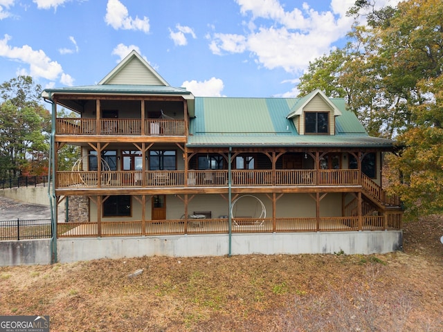 rear view of house with a balcony