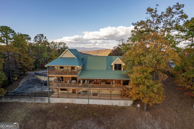 back of house featuring a mountain view