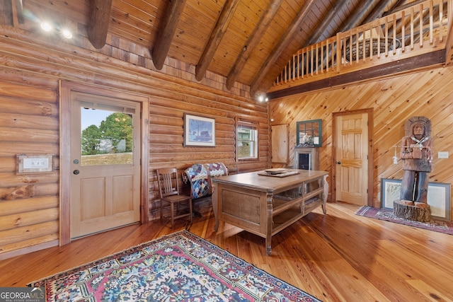 interior space featuring wooden ceiling, wood-type flooring, beam ceiling, and high vaulted ceiling