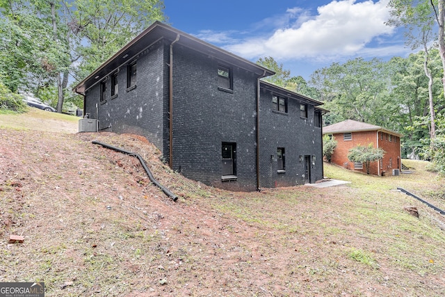 view of home's exterior featuring central AC unit