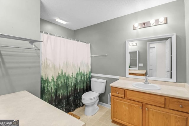 bathroom with vanity, a shower with curtain, a textured ceiling, and toilet