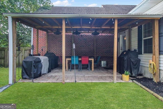 view of patio with a grill and ceiling fan