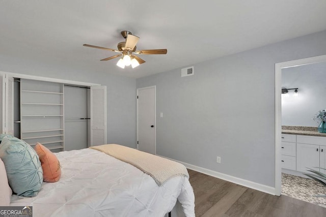 bedroom with wood-type flooring and ceiling fan