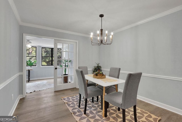 living room with ornamental molding, ceiling fan, and light hardwood / wood-style flooring