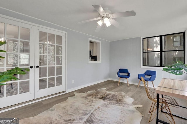 dining area featuring crown molding, hardwood / wood-style floors, and an inviting chandelier