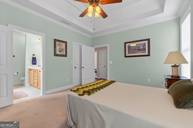 carpeted bedroom featuring ceiling fan, multiple windows, connected bathroom, and crown molding