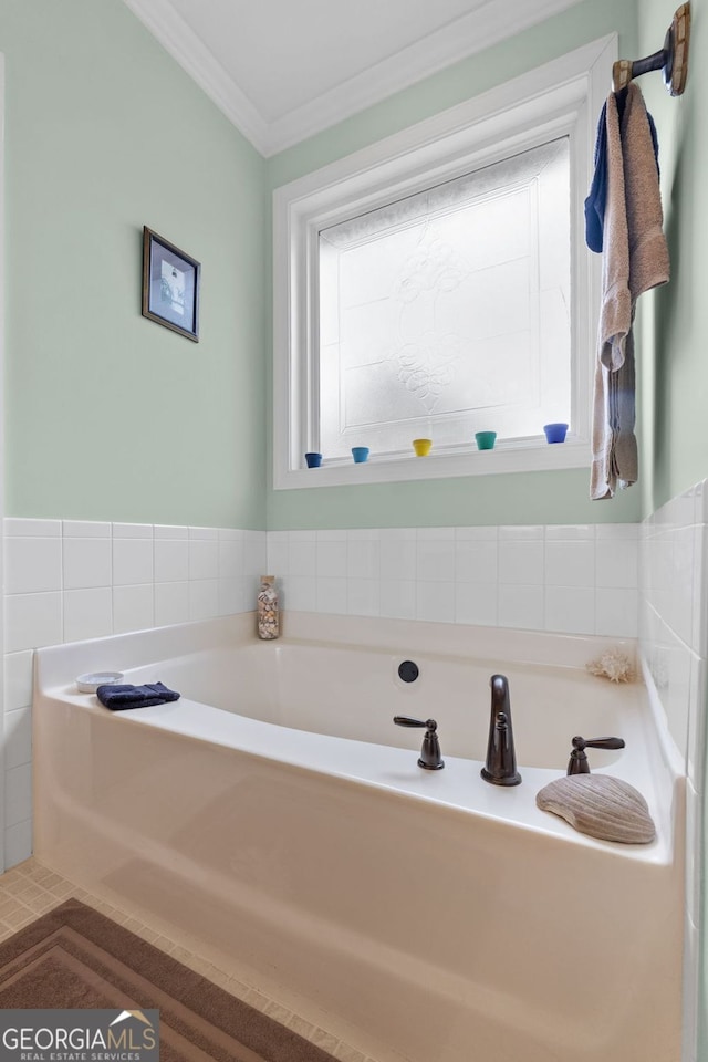 full bath with crown molding and a bath