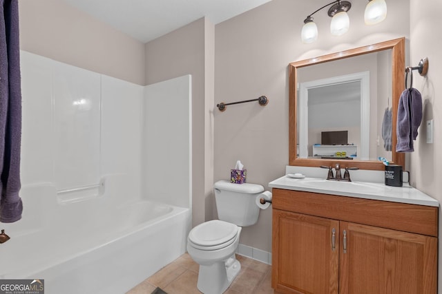 bathroom featuring shower / washtub combination, toilet, vanity, baseboards, and tile patterned floors