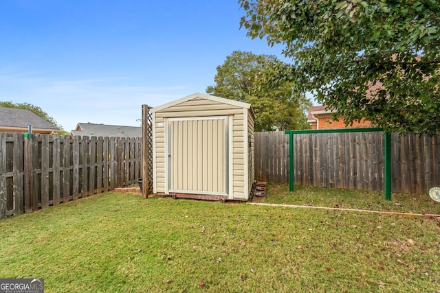 view of shed featuring a fenced backyard