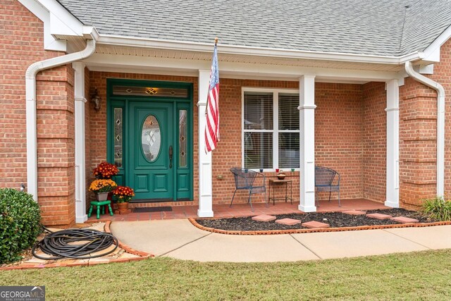 entrance to property with covered porch