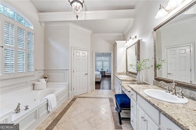 bathroom featuring hardwood / wood-style floors, a tub, vanity, and crown molding