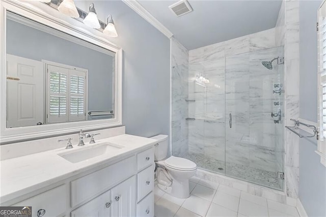 bathroom with a shower with door, ornamental molding, vanity, tile patterned floors, and toilet